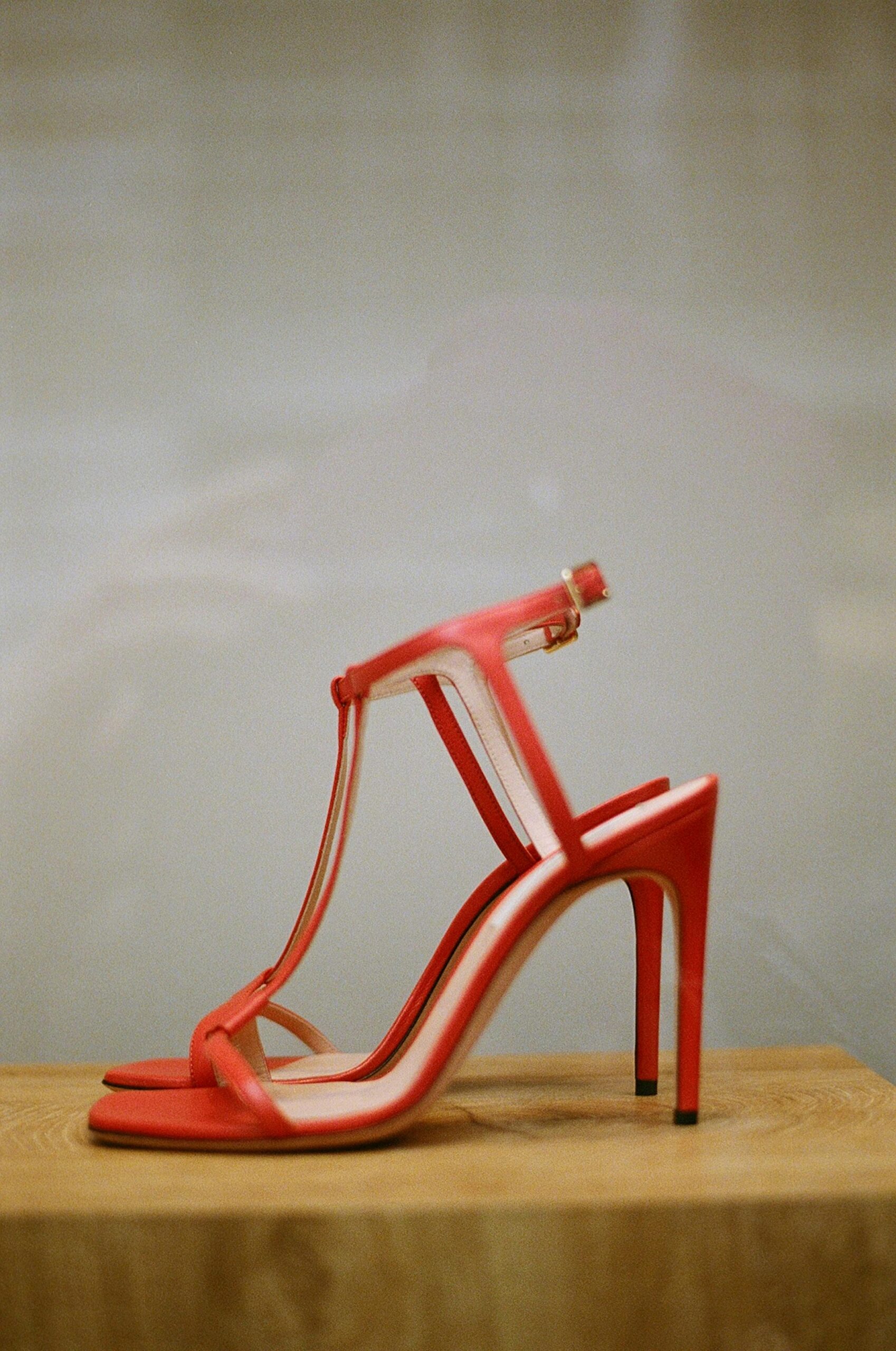Chic red high heels on a light background, perfect for fashion highlights.